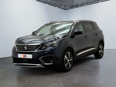 the new peugeot suv is parked in a large room