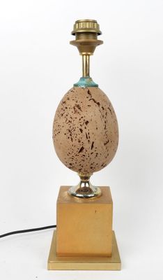 an image of a lamp that is sitting on a wooden base