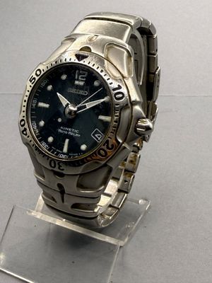 a watch that is sitting on a stand on a table