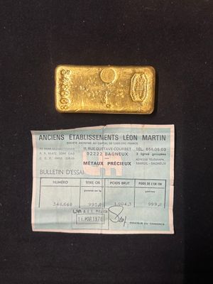 a small piece of gold on a black cloth