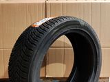 tire on the floor in front of a cardboard box and cardboard boxes