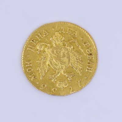 une image d'une pièce d'or sur une surface blanche