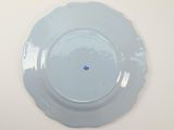 a blue plate with a small blue dot on it