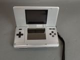 a white nintendo wii game console sitting on a table