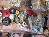 many different types of buttons and buttons in a drawer