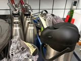stainless steel counter top with pots and utensils on it
