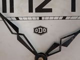 a white clock with black hands and numbers on it