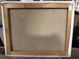an image of a picture frame sitting on top of a piece of cardboard