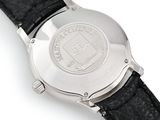 an image of a close up of a watch on a white surface