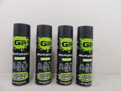 three sprays of black and green paint sitting next to each other