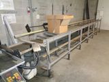 an image of a factory with a conveyor belt in the middle of the room
