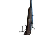 un vieux fusil avec une poignée en bois sur fond blanc