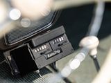 a close up of a combination lock on a car ' s dashboard