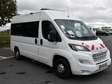 a white van that is parked in a parking lot