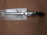a knife that is laying on top of a piece of paper