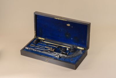 a box with tools inside of it on a table