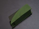 a green box with a leaf on it on a table