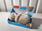 a teddy bear that is in a box on a table