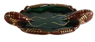 a green and gold plate with two crabs on it