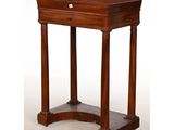 a small wooden table with a drawer on top of it