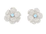 une paire de boucles d'oreilles en or blanc et topaze bleue