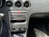 a picture of a car dashboard with a clock and other items in it