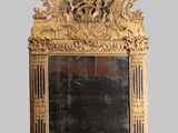 a mirror that is sitting on the wall