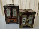 two small wooden boxes sitting next to each other on a table