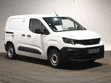 the white van is parked in a room with a checkered floor