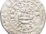 a close up of a coin with a design on it
