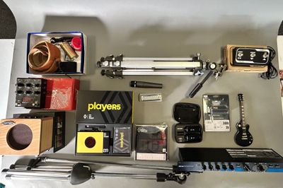 many different types of electronic equipment laid out on a table