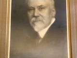 an old photo of a man with a beard and a mustache