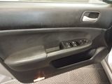 the interior of a car with the door open and the door handle open