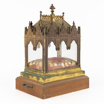 an old wooden and glass display case with a dome on top of it