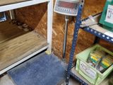 a shelf with a scale on it in a room