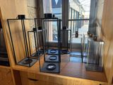 a lot of glass and metal items on a shelf