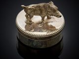 an image of a silver plate with a boar on it