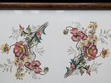 a picture of a picture of two flowers on a plate