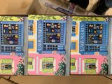 a box with a picture of a building on the inside of it