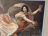 a painting of a woman holding a bunch of flowers in her hand