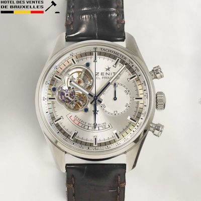 a close up of a watch on a white background