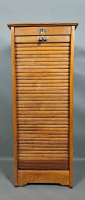 an old wooden cabinet with a drawer on top of it