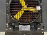 a fan that is sitting on top of a cart