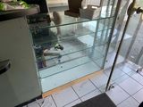 a glass display case in the middle of a kitchen