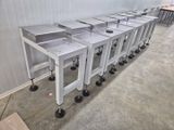 a lot of tables that are lined up in a room