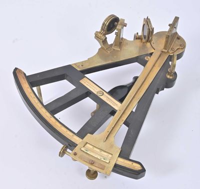 an old brass sexet on a white surface with a white background