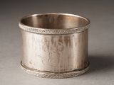 a silver cup that is sitting on a table