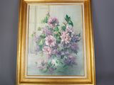 tableau représentant un bouquet de lilas dans un cadre doré accroché au mur