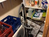 a cluttered pantry with many items on the shelves