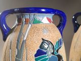 two vases that have been decorated with birds on them